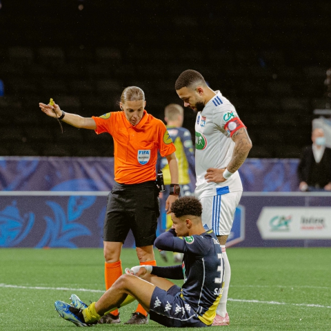  Referee St?phanie Frappart invites the injured Sofiane Diop ( #37 Monaco) to quit the pich during the French Cup Quarter final game between 
Lyon and Monaco at Groupama stadium in Lyon, France.