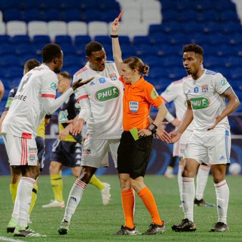  Sinaly Diomande (#? Lyon) is shown a red card by referee St?phanie Frappart while Marcelo (#6 Lyon) and Thiago Mendes (#23 Lyon) protest during the French Cup Quarter final game between 
Lyon and Monaco at Groupama stadium in Lyon, France.